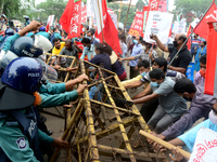 Police barricade activists of Left Democratic Alliance during demonstration in front of Jute Ministry demanding reopen all government jute m...