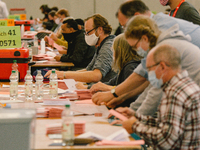 General view of election helpers counting of the votes while wearing face mask at the second round of Cologne mayoral election on September...