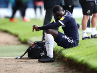   Elvis Bwomono of Southend United sitting off the pitch  during the Sky Bet League 2 match between Southend United and Morecambe at Roots H...