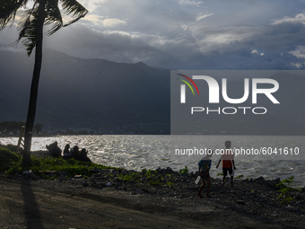 Residents brought their family members to the former tsunami site on Talise Beach, Palu, Central Sulawesi Province, Indonesia on September 2...