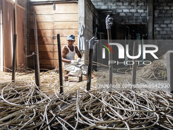 A workers prepare rattan used as material to make coffin crafts at Transan Village, Sukoharjo Regency, Central Java Province, Indonesia on S...