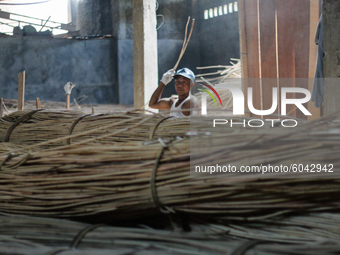 A workers prepare rattan used as material to make coffin crafts at Transan Village, Sukoharjo Regency, Central Java Province, Indonesia on S...