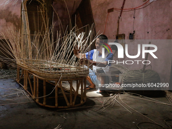 A workers make coffin crafts from rattan at Transan Village, Sukoharjo Regency, Central Java Province, Indonesia on September 29, 2020. The...
