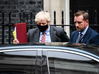 British Prime Minister Boris Johnson leaves 10 Downing Street for PMQs at the House of Commons on 30 September, 2020 in London, England. Tod...