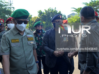  The veterans are part of a retired guard of state sovereignty attended  General (retired) Gatot Nurmantyo (central) during a flower-sowing...