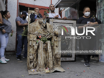 Dozens of followers of La Santa Muerte, also known as ''Nina Blanca'', visited her temple located on Calle Alfareria, Tepito, to thank her f...