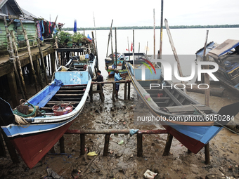 Fisherman in Sungsang, Banyuasin Regency, South Sumatera were repairing their ship on Saturday, September 26, 2020. (