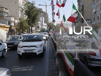 Vehicles drive along an avenue in northern Tehran while the new coronavirus (COVID-19) disease rapid rising in Iran on October 4, 2020. Tehr...