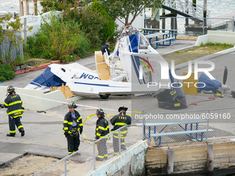 Small plane crash into a pier near Beechhurst Yacht Club in Whitestone Queens, United States, on October 4, 2020. (