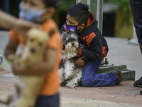 Parishioners take their pets for a blessing on St. Francis of Assisi Day, on October 4, 2020,at St. Julian's Parish in the northern part of...
