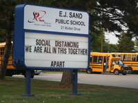 Sign outside an elementary school promoting social distancing (physical distancing) during the novel coronavirus (COVID-19) in Toronto, Onta...