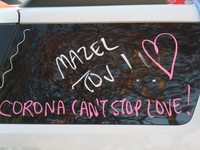 The words 'Corona can't stop love' written on the wedding car of a newly married Jewish couple in the midst of the coronavirus (COVID-19) pa...