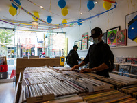 Several people browses records at a used record shop, in Toronto, Canada, on October 06, 2020. (