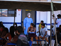 Members of the indigenous Guajajara ethnic group are seen waiting for medical care from the Brazilian Armed Forces medical team, amid the Co...