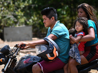 Members of the indigenous Guajajara ethnic group are seen riding a motorcycle amid the Coronavirus (COVID-19) pandemic, at the Guajajara ind...