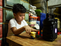 A kindergarten student attends his online class at his home in Manila, Philippines on October 7, 2020.(