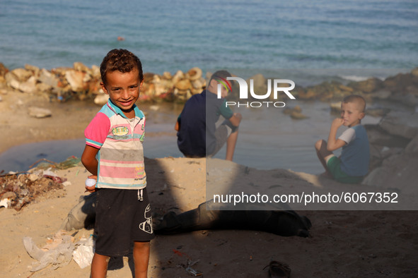 Palestinian children are seen next to Gaza beach in Al Shataa refugee camp in Gaza City, on October 8, 2020, amid the ongoing pandemic of th...