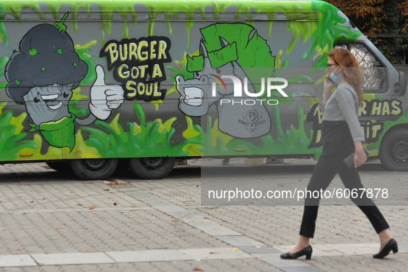 A lady walks by a Burger Van restaurant in Sofia center. 
The number of people infected with COVID-19 in Bulgaria is increasing, with the hi...