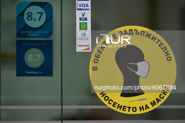 A sticker 'Wear the mask' seen at the entrance to a hotel in Sofia.
The number of people infected with COVID-19 in Bulgaria is increasing, w...