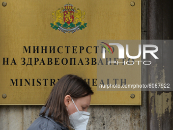 A lady wearing a protective mask passes next to the entrance to the Ministry of Health in Sofia.
The number of people infected with COVID-19...