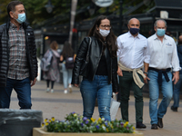 People wearing protective masks seen walking in Vitosha Boulevard, the main commercial street in the centre of Sofia. 
The number of people...