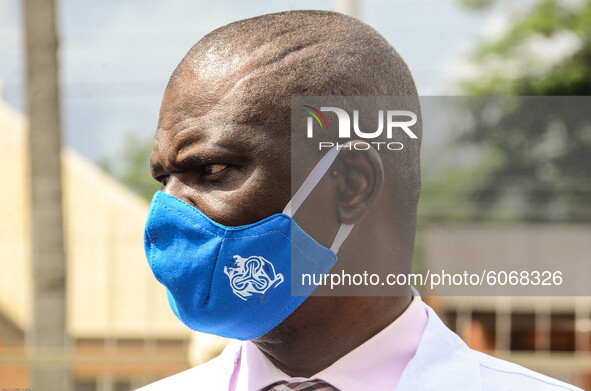 Official of Central Bank of Nigeria wearing a nose mask looks on during the distribution of sensitive electoral materials, which is too dist...