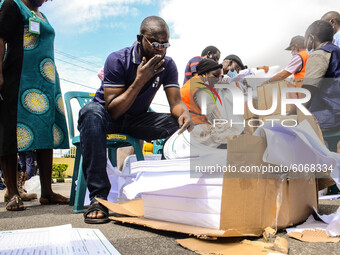 A man taking records of electoral materials, during the distribution of electoral materials to different local government areas at the centr...