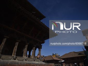 Nepalese people takes rest around the Patan Durbar Square, a UNESCO world heritage site, Lalitpur, Nepal on October 08, 2020. (