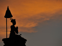 A Silhouette view of King Bhupatindra Malla statue in the Golden hour evening at Bhaktapur Durbar Square, a UNESCO world heritage site, Bhak...