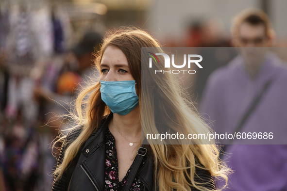 A woman is seen wearing a face mask in Warsaw, Poland on October 8, 2020. The ministry of health on Thursday announced 4280 new infections o...