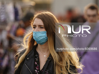 A woman is seen wearing a face mask in Warsaw, Poland on October 8, 2020. The ministry of health on Thursday announced 4280 new infections o...