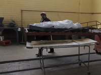 The body of a deceased person is transferred to the crematorium of the Municipal Pantheon of Nezahualcóyotl, State of Mexico. The pantheon c...