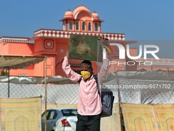 Polling officials carrying EVMs leave ahead of the fourth phase of Panchayat elections in Rajasthan, at Bhawani Niketan in Jaipur, India on...