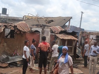 Affected residents watch their property at the scene of gas explosion in Bauwa, Lagos on Thursday. Gas explosion from Best Roof Cooking Gas...