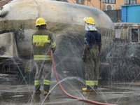 Fire fighters put out fire at the scene of gas explosion in Bauwa, Lagos on Thursday. Gas explosion from Best Roof Cooking Gas Station kille...