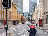 A woman in protective face mask is seen walking at Waterloo Bridge street as cases of Covid-19 rise during the second wave of Coronavirus in...