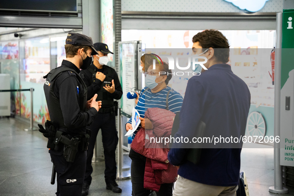 The police ask for identification documents at the Atocha train station, in Madrid, Spain, on October 09, 2020, after the entry into force o...