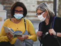 Tourists are wearing protective face masks during while visotong Krakow coronavirus pandemic. Krakow, Poland on October 9th, 2020. Due to th...