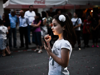 A littke girl waiting to take pictures of the high school graduates in the town of Svilengrad, Bulgaria on May 26, 2015 (