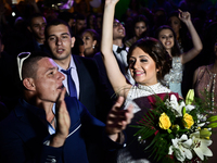 Boys and girls in fancy dresses celebrate the end of their high school education in the Bulgarian town of Svilengrad on May 26, 2015 (