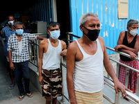 People with covered faces as a precautionary measure against COVID-19, during nasal swab sample collection for corona virus Rapid Antigen Te...