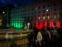 People wearing protective masks walks near Chigi Palace,  in Rome, Italy, on October 10, 2020 amid the COVID-19 pandemic. (