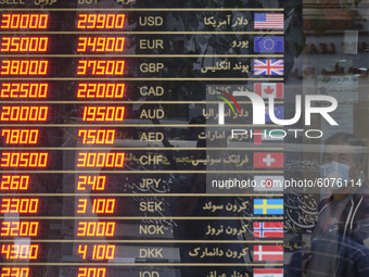 An Iranian man looks on as he stands in a currency exchange shop in Tehran’s business district on October 10, 2020. U.S. Dollar has risen ag...