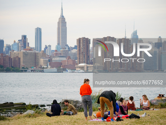 People enjoy the fall weather at Bushwick Inlet Park, Brooklyn. New York  City enters Phase 4 of re-opening following restrictions imposed t...