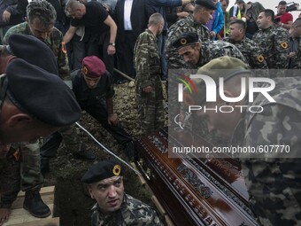 PRISTINA, KOSOVO-- May 26, 2015- Kosovar Liberation Army soldiers helped one of eight men buried in Pristina today.  Eight ethnic Albanian g...
