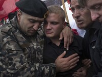 PRISTINA, KOSOVO-- May 26, 2015- Family members mourn for Mirsad Ndrecai, one of eight Kosovar men accused of being terrorists during a fune...
