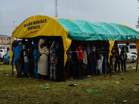 Voters wait under a canopy as rain disrupt voting process at scared heart primary in schoolGbogi/Isikan, in Akure South Ondo State on Octobe...