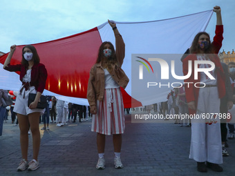 People demonstrate at the Main Square in solidarity with Belarus. Krakow, Poland on October 10, 2020. Belarusians living in Krakow and suppo...