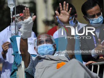 Dr. Govinda KC reacts after ends 19th hunger strike on 28th day on Sunday, October 11, 2020 by drinking juice from a sanitation staffer Bika...