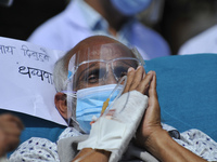 Dr. Govinda KC reacts after ends 19th hunger strike on 28th day on Sunday, October 11, 2020 by drinking juice from a sanitation staffer Bika...